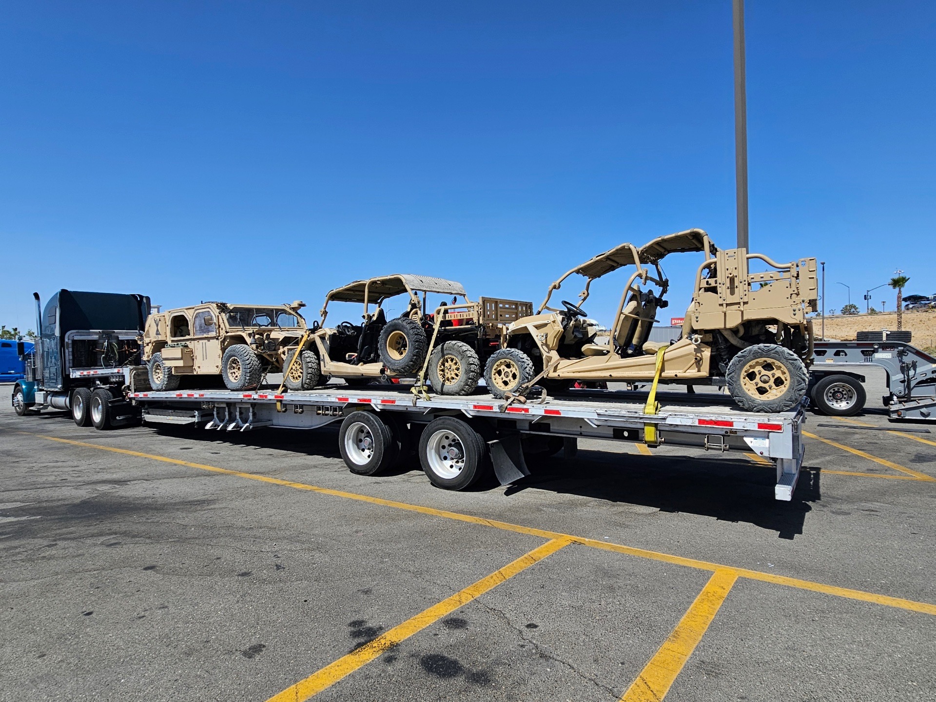 RIGID truck hauling oversized cable reels