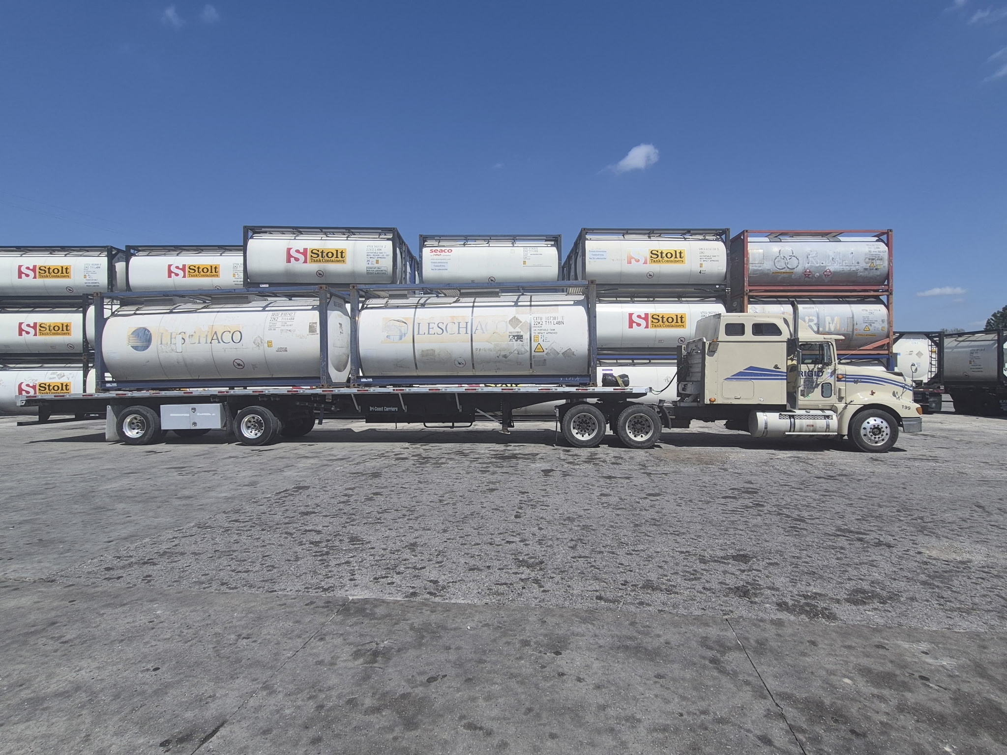 RIGID flatbed truck parked with a freight load